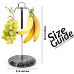 Black marble banana holder measuring 12.5 inches tall and 6.5 inches wide, hung with bananas and grapes