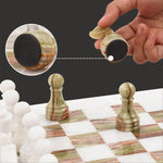 Green onyx marble chess piece lifted showing individual felt bottom — RADICALn white and black marble chess set 15 inch
