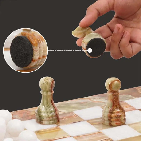 Green onyx on marble chess piece lifted showing individual felt bottom — RADICALn green onyx and white marble chess set 15 inch