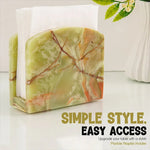 Green onyx marble napkin holder filled with white napkins on a styled countertop