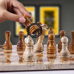 Hand lifting red chess pawn with felt bottom detail — coral-and-red pieces in starting position by RADICALn