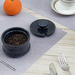 Sophisticated marble kitchen accessory, salt cellar with spoon, for easy seasoning access.