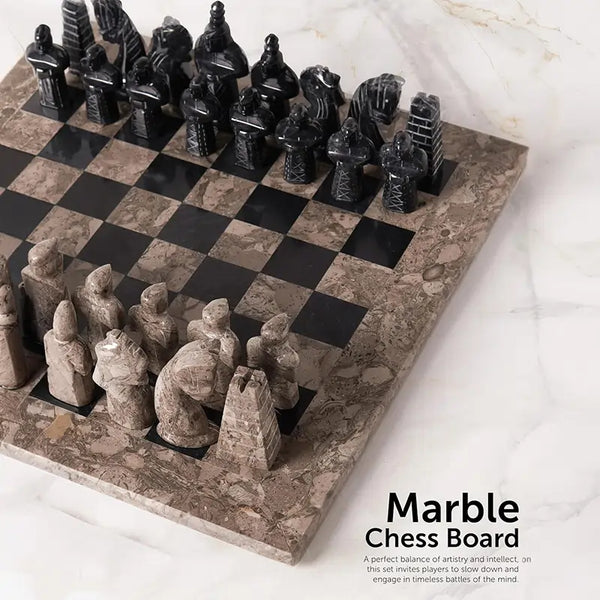 Oceanic grey and black antique marble chess set angled view — medieval figurative pieces in starting position on marble surface by RADICALn