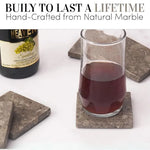 Handmade oceanic square marble coasters under a glass of sparkling drink