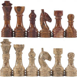 Red and fossil coral marble chess pieces lineup — king queen bishop knight rook pawn by RADICALn