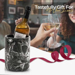 Round black marble wine chiller with gift ribbon, presented as a present for wine lovers