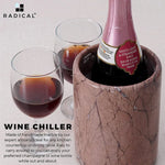 Handmade round marinara marble wine cooler chilling a bottle beside two filled glasses