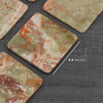 Square green onyx marble coasters with white veining, 3.5 inches across