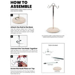 How to assemble a marble banana holder in three steps, with travertine base, two metal rods and multi-hook head shown
