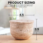 Travertine marble garlic keeper with vented lid, measuring 4.5 inches wide and 3.5 inches tall