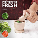 Verona marble mortar and pestle used to grind fresh herbs for pesto, guacamole and salsa