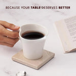 Verona square marble coaster under a white coffee cup beside an open book
