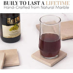 Handmade verona square marble coasters under a glass of sparkling drink