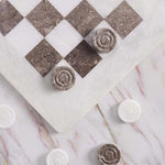 White and oceanic marble checkers set 15 inch — board corner detail with white and oceanic marble disc pieces on marble surface by RADICALn