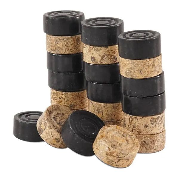 Black and fossil coral marble checkers pieces stacked — showing stackable natural stone disc construction by RADICALn