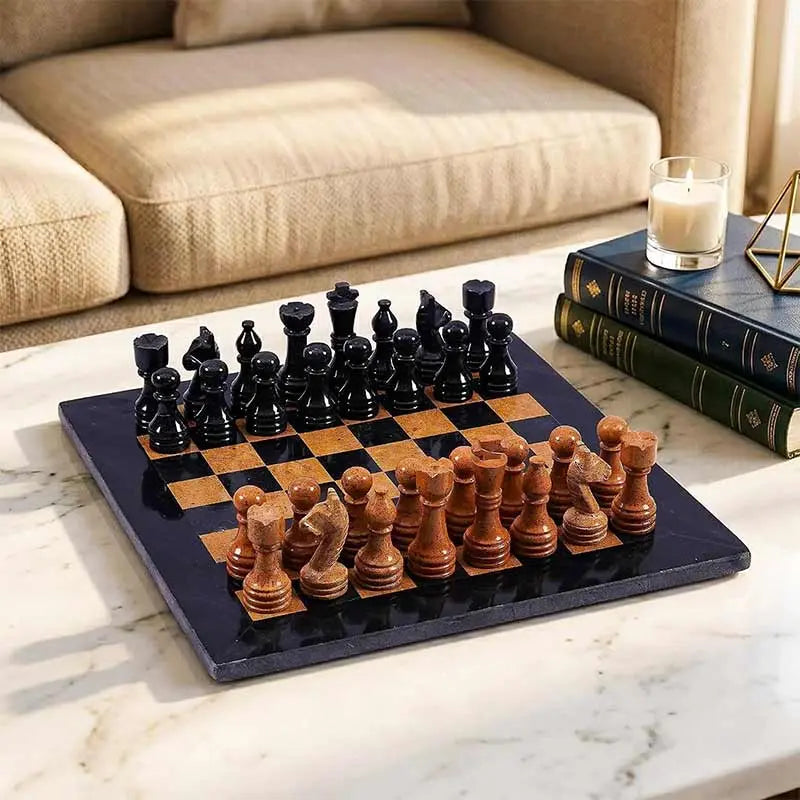 Black & Golden Marble Chess Set displayed on a white marble coffee table as elegant living room decor