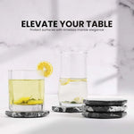 Black octagon marble coasters under two glasses of lemon water and iced tea