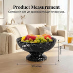 Black marble pedestal fruit bowl measuring 10 inches wide and 5 inches tall, holding fruit on a coffee table