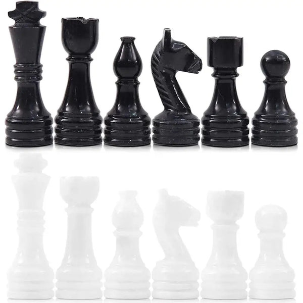 Black marble and white chess pieces lineup — king queen bishop knight rook pawn by RADICALn