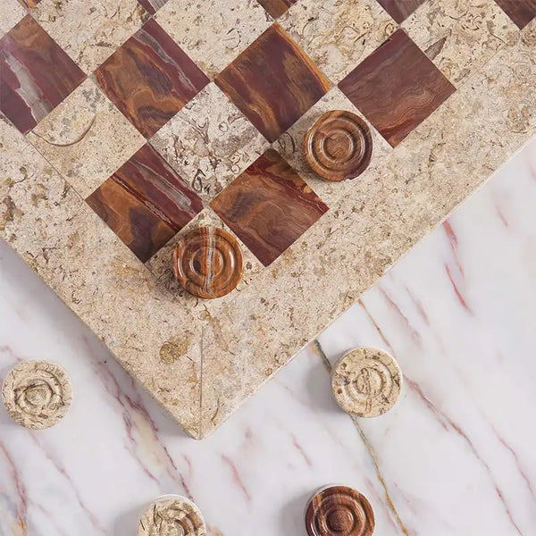 Coral and red marble checkers set 15 inch — board corner detail with coral and red marble disc pieces on marble surface by RADICALn