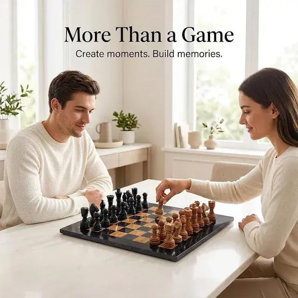 Couple playing on a Black & Golden Marble Chess Set at a white table in a bright, sunlit room