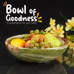 Green onyx marble fruit bowl filled with apples, grapes and a pear as a table centerpiece