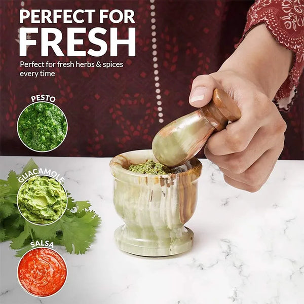 Green onyx marble mortar and pestle used to grind fresh herbs for pesto, guacamole and salsa