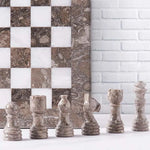 Grey oceanic marble chess pieces lineup — pawn bishop knight rook king queen with grey oceanic and white board edge by RADICALn