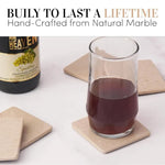 Square verona marble coasters under a glass of sparkling drink beside the bottle