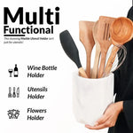 Hexagon white marble utensil holder held in hand, doubling as a wine bottle and flower holder