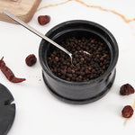 Handmade marble salt cellar with spoon, each piece unique due to natural variations in marble.