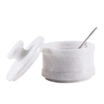 Marble salt cellar with secure lid, offering practical storage for salt and spices.