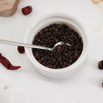 Natural marble salt container with spoon, perfect for kitchen and dining use