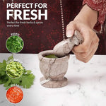 Marinara marble mortar and pestle used to grind fresh herbs for pesto, guacamole and salsa