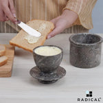 Radicaln oceanic marble butter keeper holding soft butter while a slice of toast is buttered