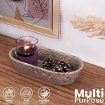 Oceanic marble dough bowl as multi-purpose decor holding a candle and pinecones