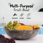 Oceanic marble fruit bowl filled with mango, pear and grapes on a kitchen counter, also suited to vegetables, candies or cookies