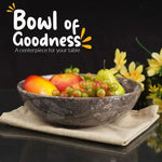Oceanic marble fruit bowl filled with apples, grapes and a pear as a table centerpiece