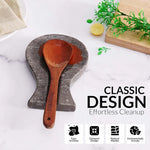 Oceanic marble spoon rest holding a wooden ladle on a countertop