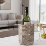 Oceanic marble wine cooler chilling wine on a candlelit dinner table with grapes