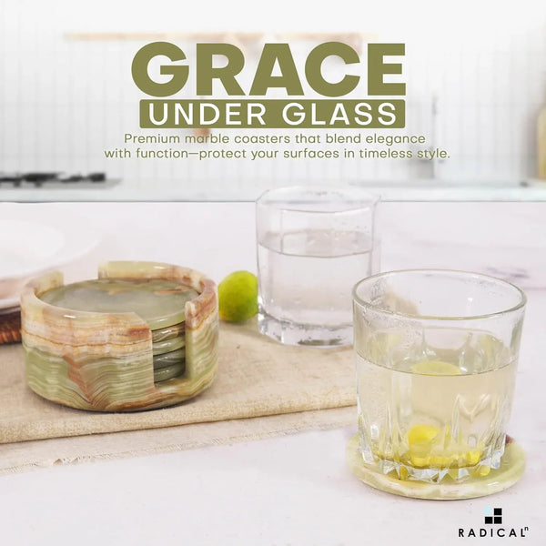 Round green onyx marble coaster set and holder beside drinking glasses on a kitchen counter