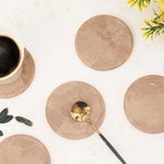 Set of six round verona marble coasters for drinks with a coffee cup and gold spoon