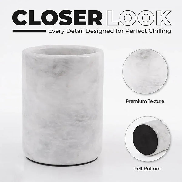 Close-up of round white marble wine chiller showing polished stone texture and protective felt bottom