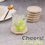 Stacked travertine octagon coasters beside a glass of iced lime water
