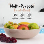 Verona marble fruit bowl filled with mango, pear and grapes on a kitchen counter, also suited to vegetables, candies or cookies