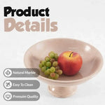 Verona marble pedestal fruit bowl with an apple and grapes, showing the natural stone and polished finish