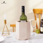 Verona marble wine cooler chilling wine on a candlelit dinner table with grapes