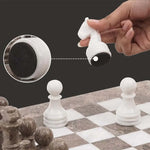 White marble chess piece lifted showing individual felt bottom — RADICALn white and black marble chess set 15 inch