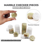 White and green marble checker pieces close-up — hand holding green marble disc showing concentric ring detail, stacked discs by RADICALn