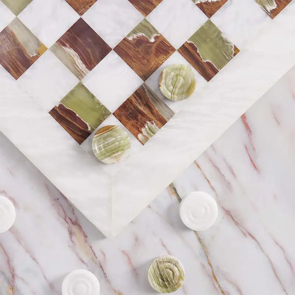 White and green marble checkers set 15 inch — board corner detail with white and green marble disc pieces on marble surface by RADICALn